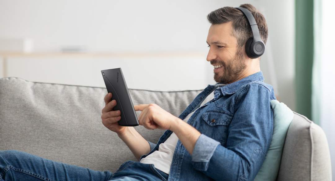 boy reading and listening on inkBOOK Solaris